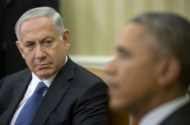  Israeli Prime Minister Benjamin Netanyahu listens as President Barack Obama speaks during their meeting in the Oval Office of the White House in Washington, Wednesday. (Pablo Martinez Monsivais/AP) 