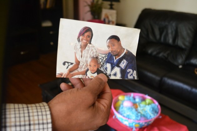 Samuel Scott holds a photograph of Walter Scott (R), his cousin. (Christina Elmore/Post and Courier)