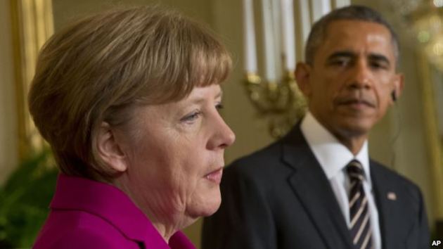 President Barack Obama and German Chancellor Angela Merkel participate in a joint news conference in the East Room of the White House in Washington, Feb. 9, 2015.