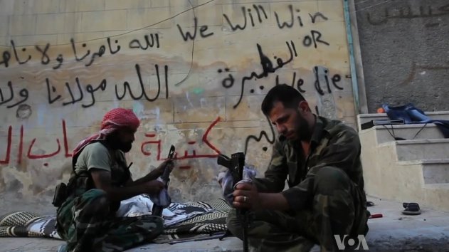 FSA rebels cleaning their AK47s in Aleppo, Syria during the civil war (19 October 2012).