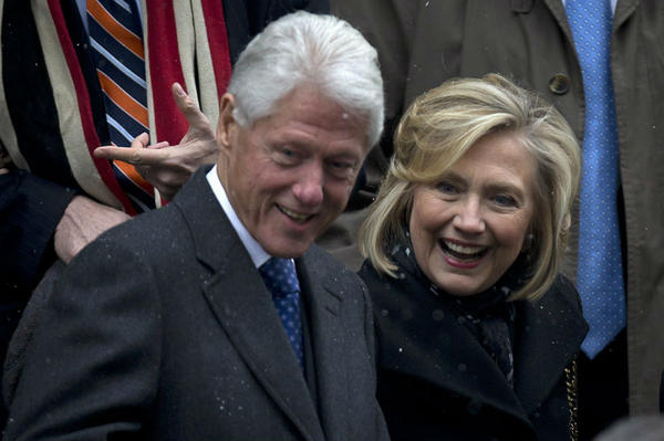  Former President Bill Clinton and former Secretary of State Hillary Clinton depart the former Governor of New York Mario Cuomo's funeral in Manhattan, N.Y., on Jan. 6. A new poll suggests that Ms. Clinton's stint as first lady could be a plus for her potential presidential bid.