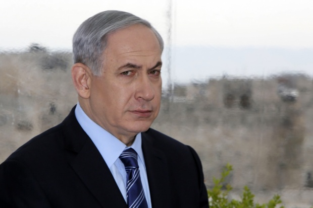 Prime Minister Netanyahu looks on during a press conference with Jerusalem mayor Nir Barkat (AFP)