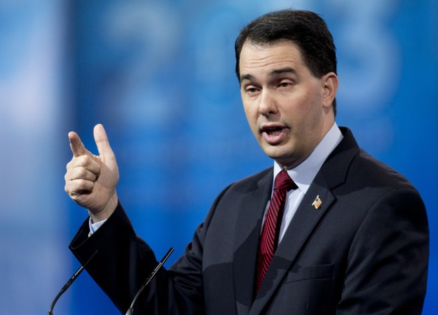 Wisconsin Gov. Scott Walker gestures as he speaks at the 40th annual Conservative Political Action Conference in National Harbor, Md., Saturday, March 16, 2013. (AP Photo/Carolyn Kaster) 