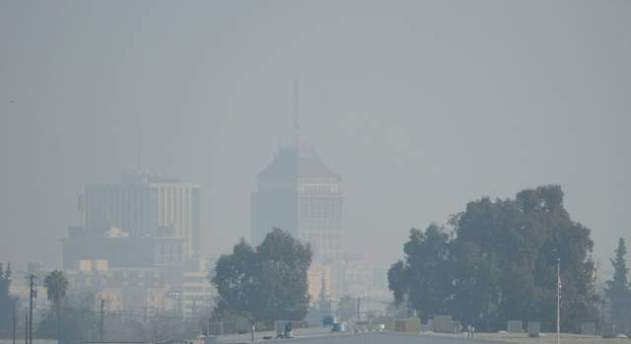The downtown Fresno skyline with heavy haze is seen, Jan. 17, 2014.