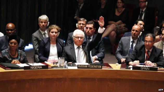 Vitaly Churkin, Russia's ambassador to the United Nations, votes to veto on a draft resolution for establishing a tribunal to prosecute those responsible for downing the MH17 flight during a UN Security Council meeting in New York in July. 