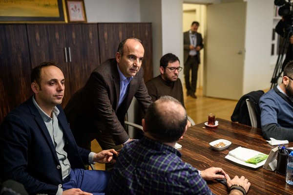 Zaman’s editor in chief, Abdulhamit Bilici, second from left, on Friday with journalists who came to offer support. Credit Ozan Kose/Agence France-Presse — Getty Images