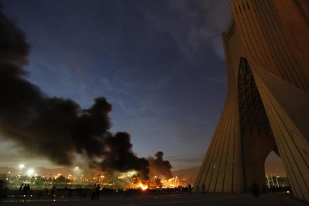 A Basij militia base burns following protests in Tehran, June 2009. Stringer / Reuters