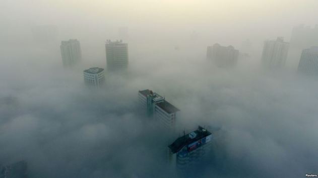 Buildings are seen on a hazy day in Xiangyang, Hubei province, China, Dec. 31, 2016. The current round of air pollution struck Friday and isn't expected to lift until Thursday.